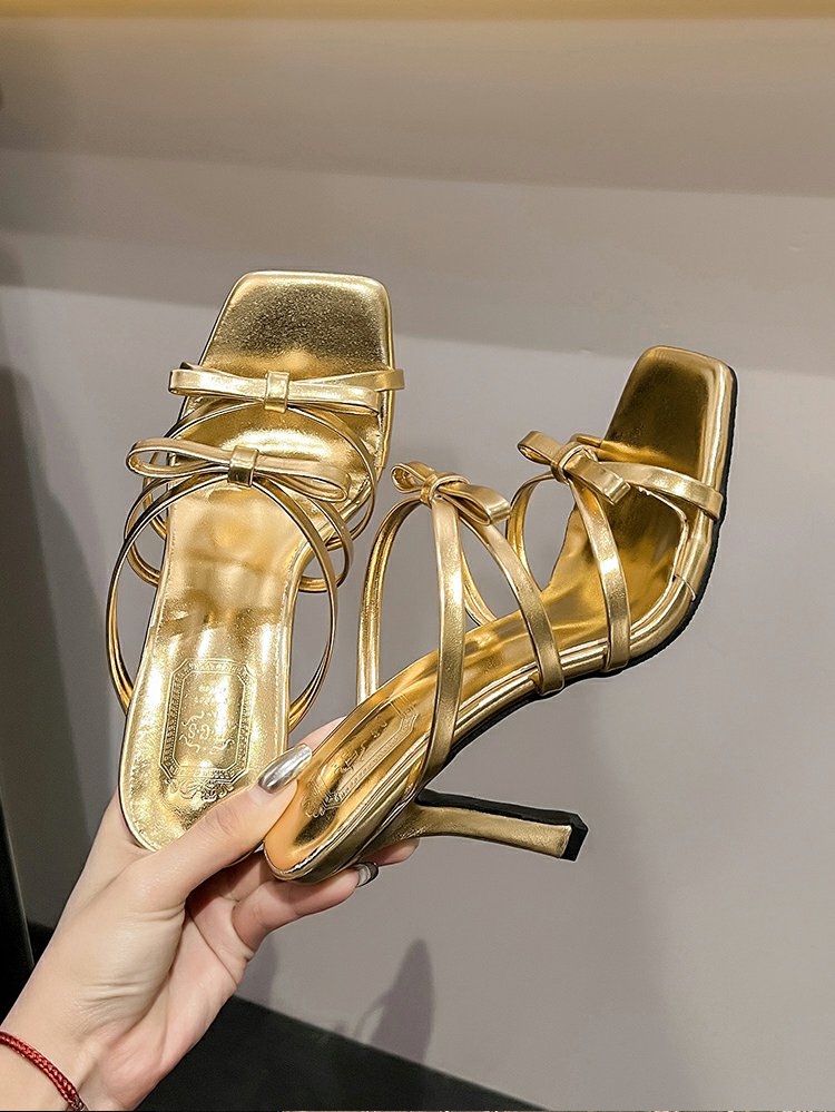 Bow tie stiletto heel sandals