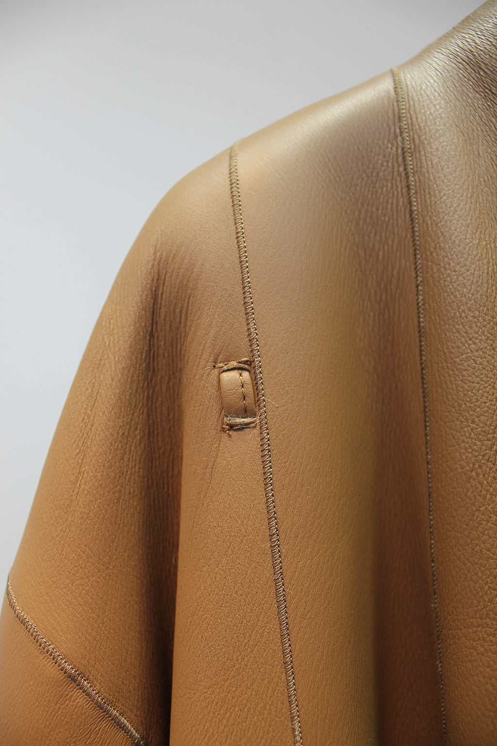 Palace-level Spanish Little Tuscan sheepskin all-in-one mid-length coat