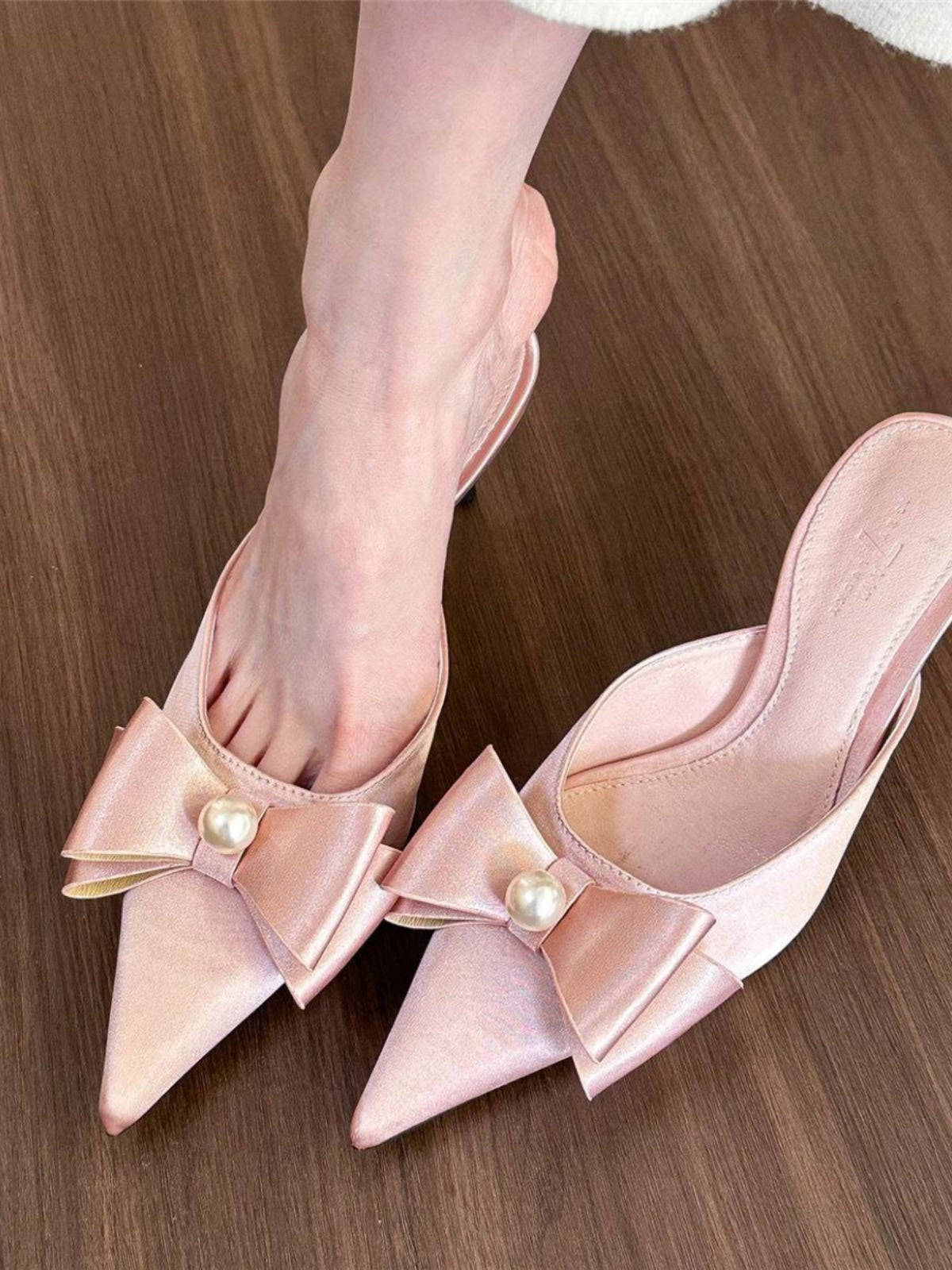 Pointed toe pearl bow pumps