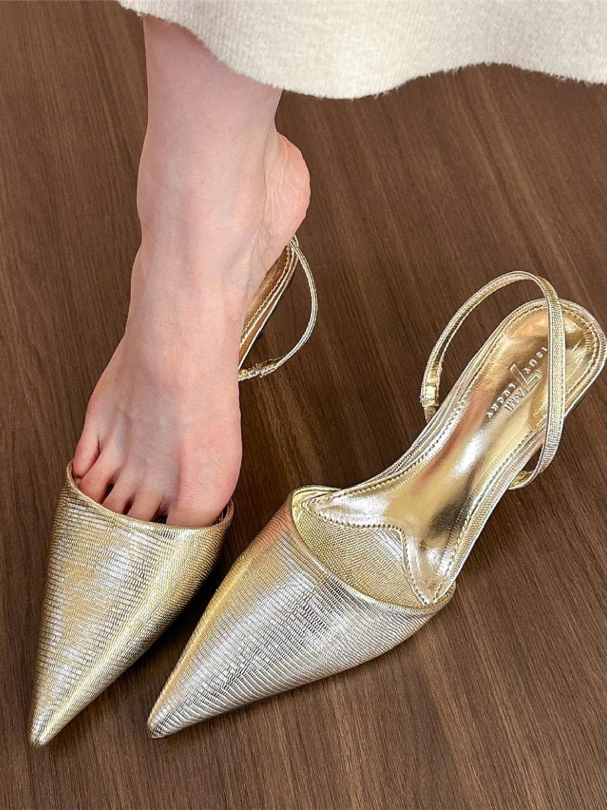 Golden pointed toe shallow back high heels