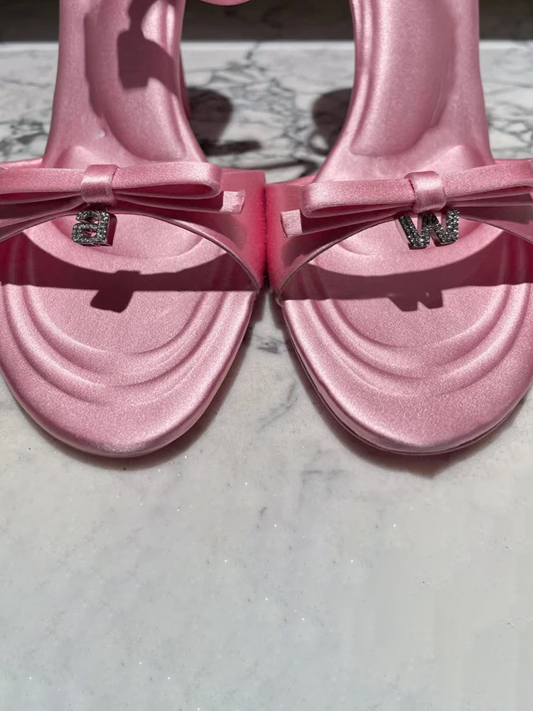 Silk satin drop-toe stiletto pumps with bow and rhinestone letters