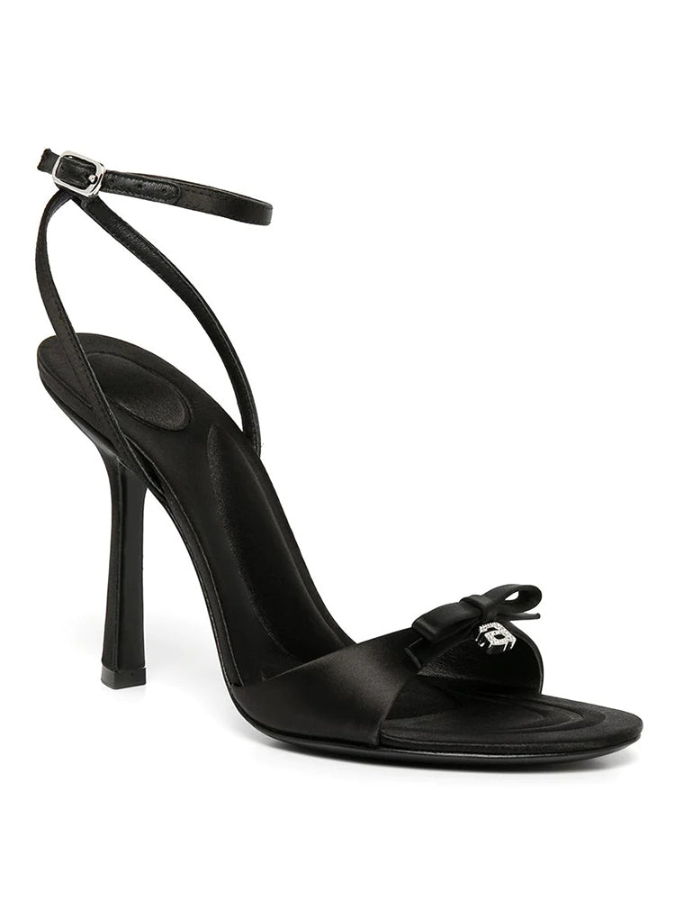 Silk satin drop-toe stiletto pumps with bow and rhinestone letters