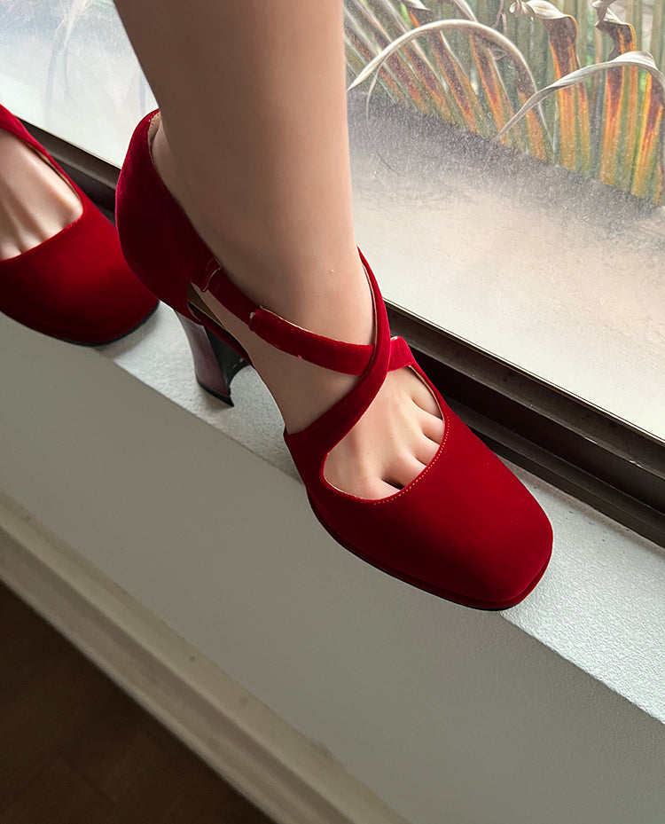 Red cross-strap round toe pumps