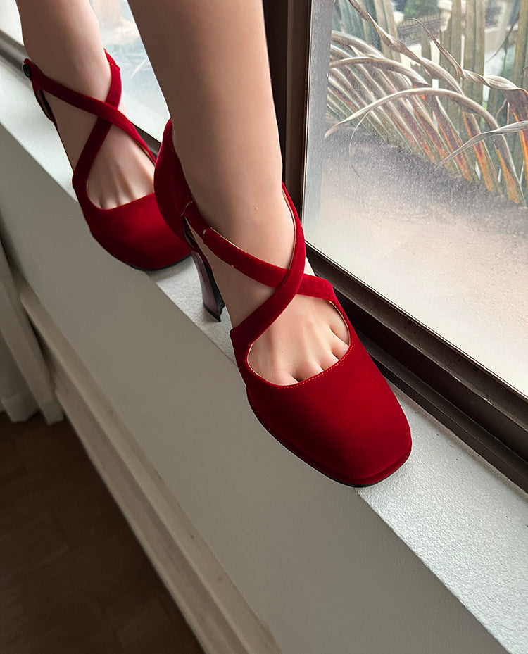 Red cross-strap round toe pumps