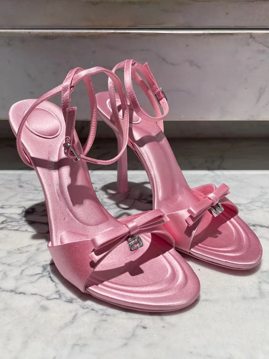 Silk satin drop-toe stiletto pumps with bow and rhinestone letters