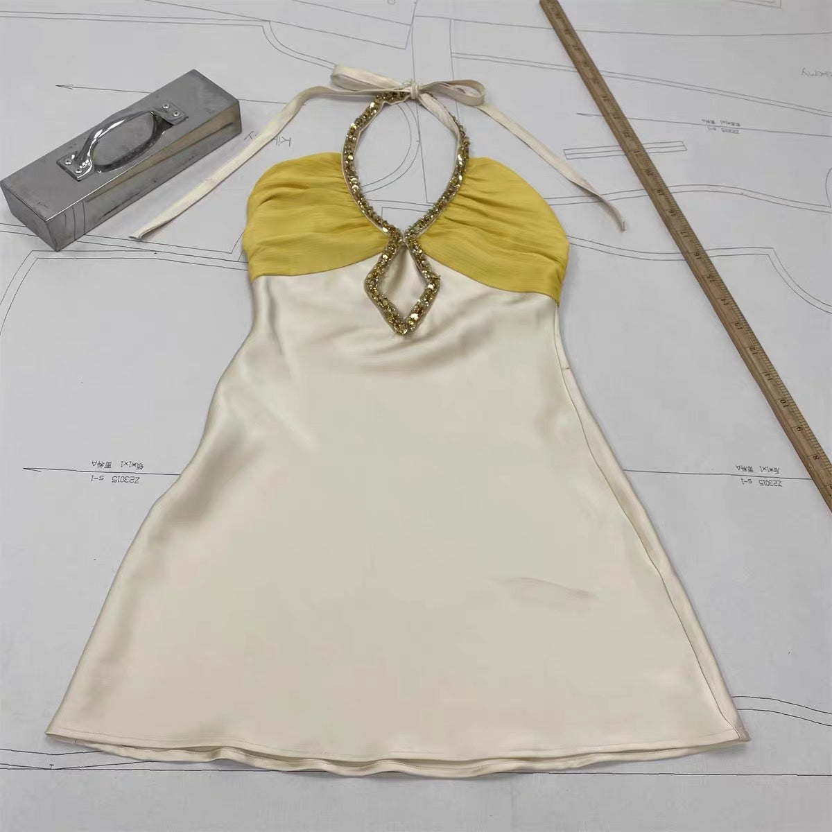 Hand-sewn heavy-duty diamond button halter dress