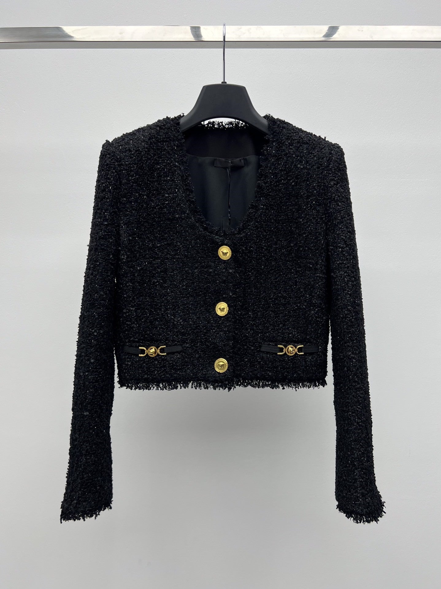 Tweed suit with gold buttons