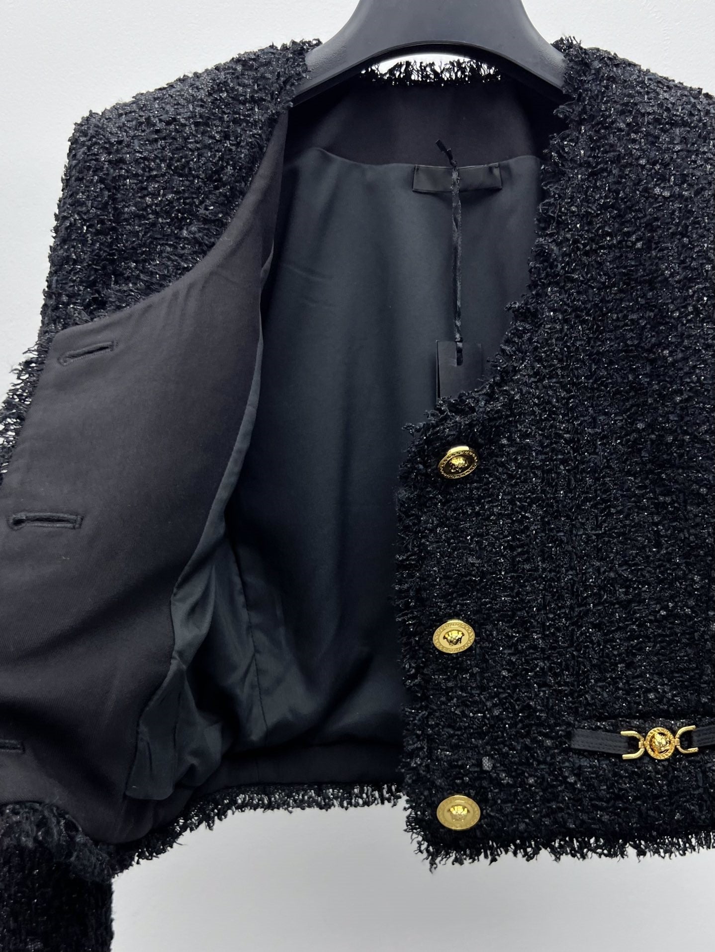 Tweed suit with gold buttons