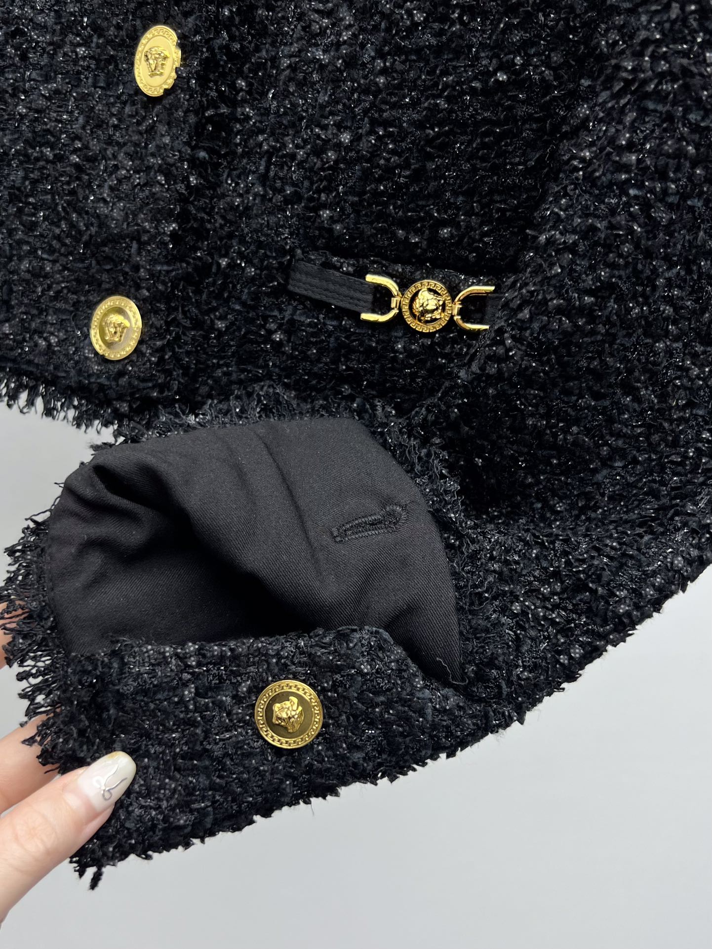 Tweed suit with gold buttons