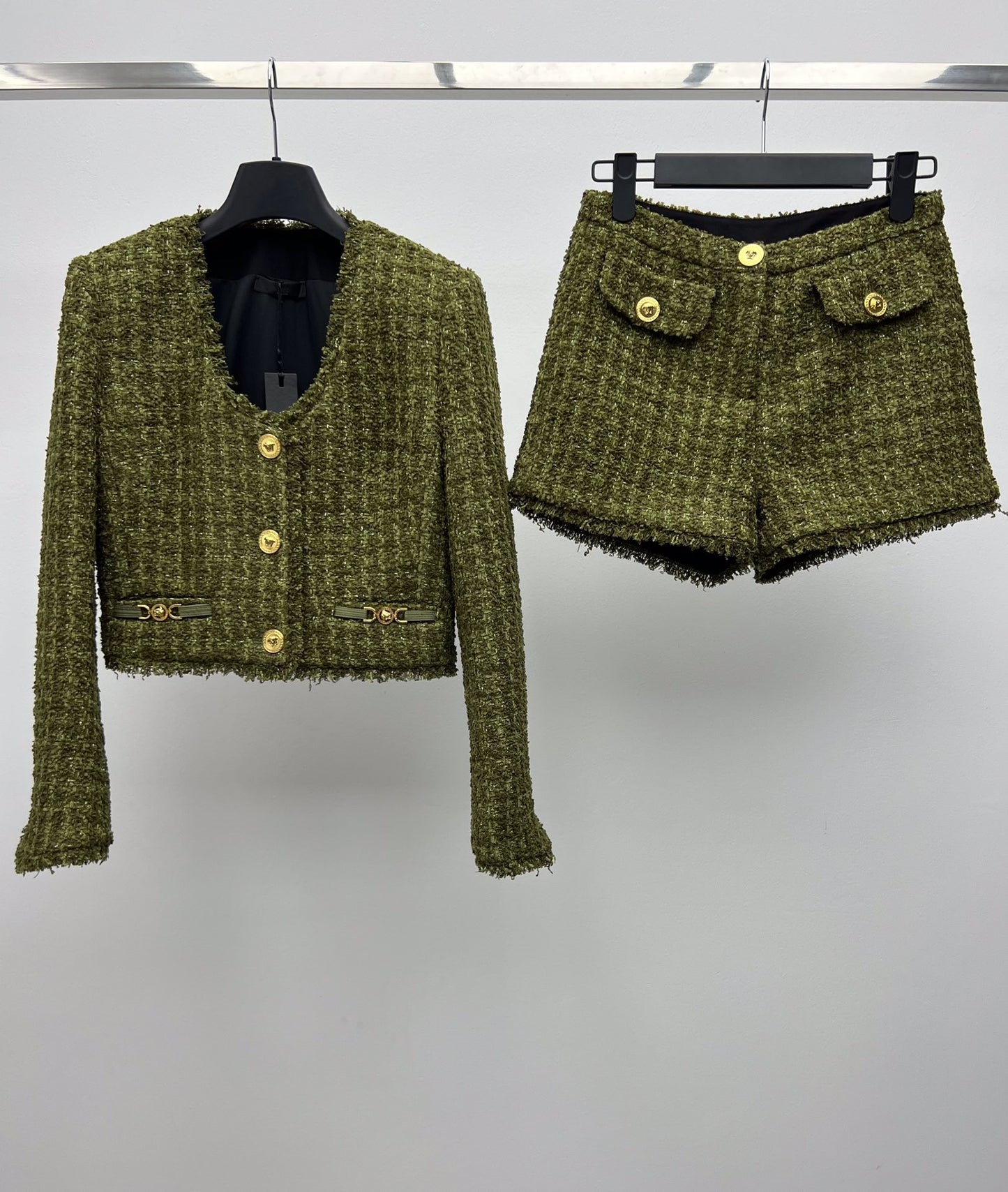 Tweed suit with gold buttons