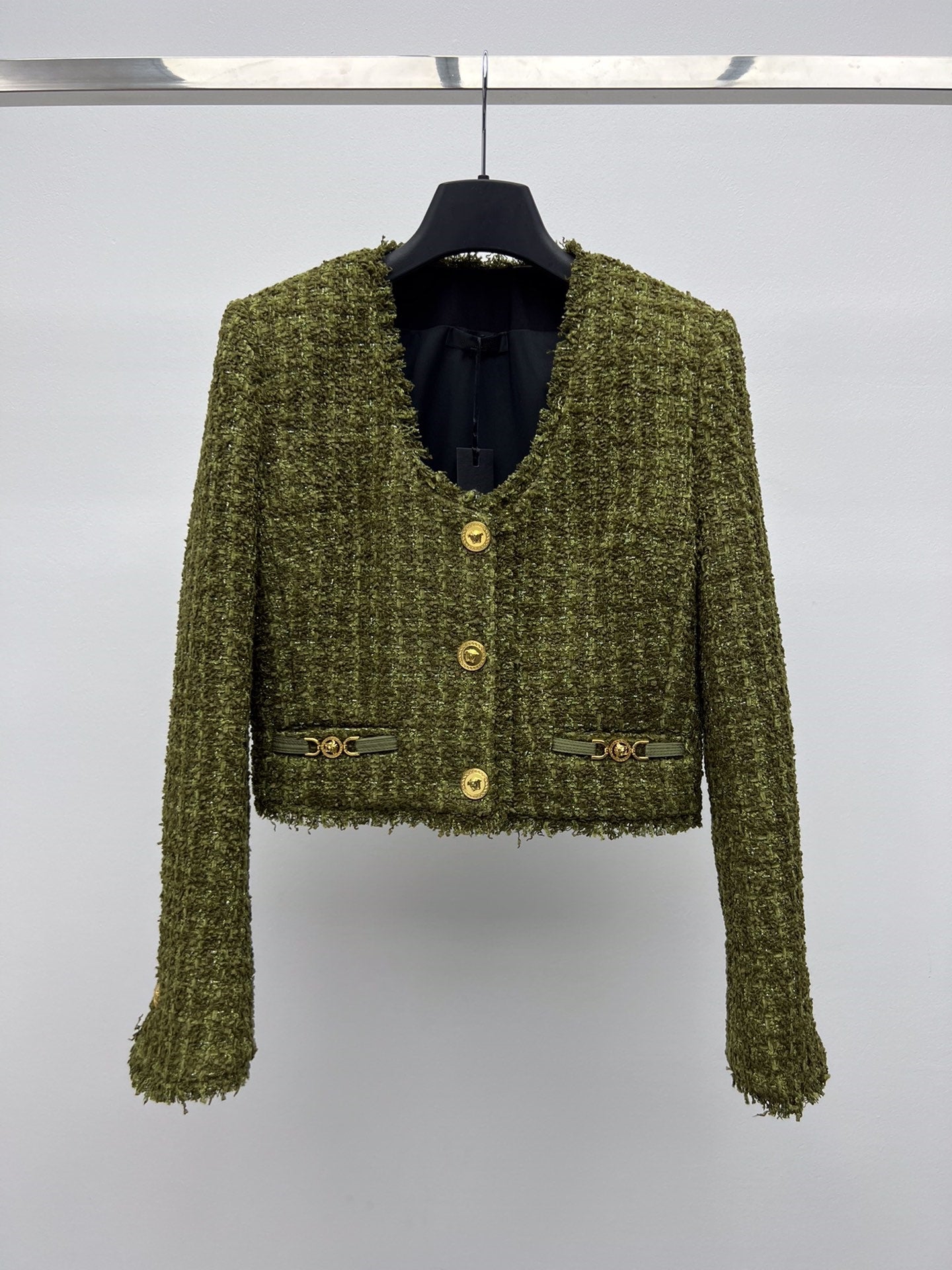 Tweed suit with gold buttons