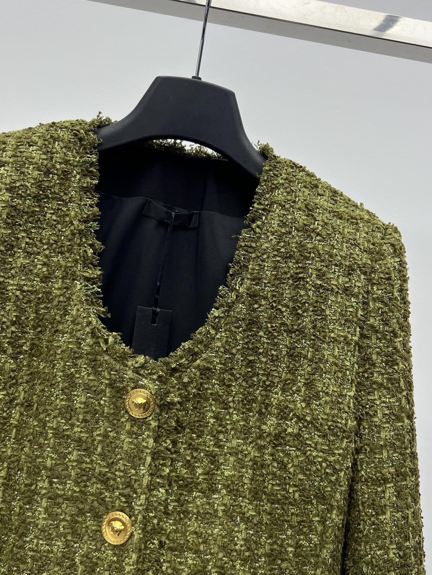 Tweed suit with gold buttons