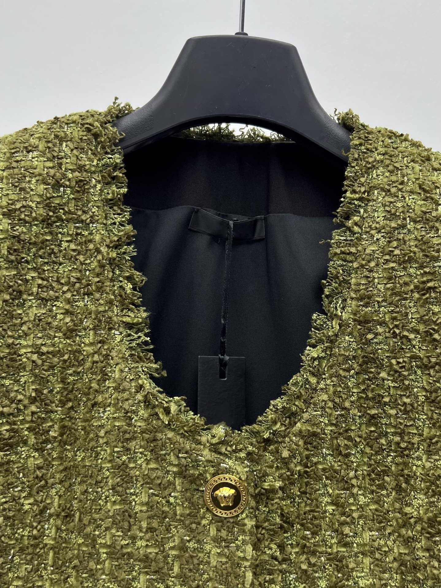 Tweed suit with gold buttons