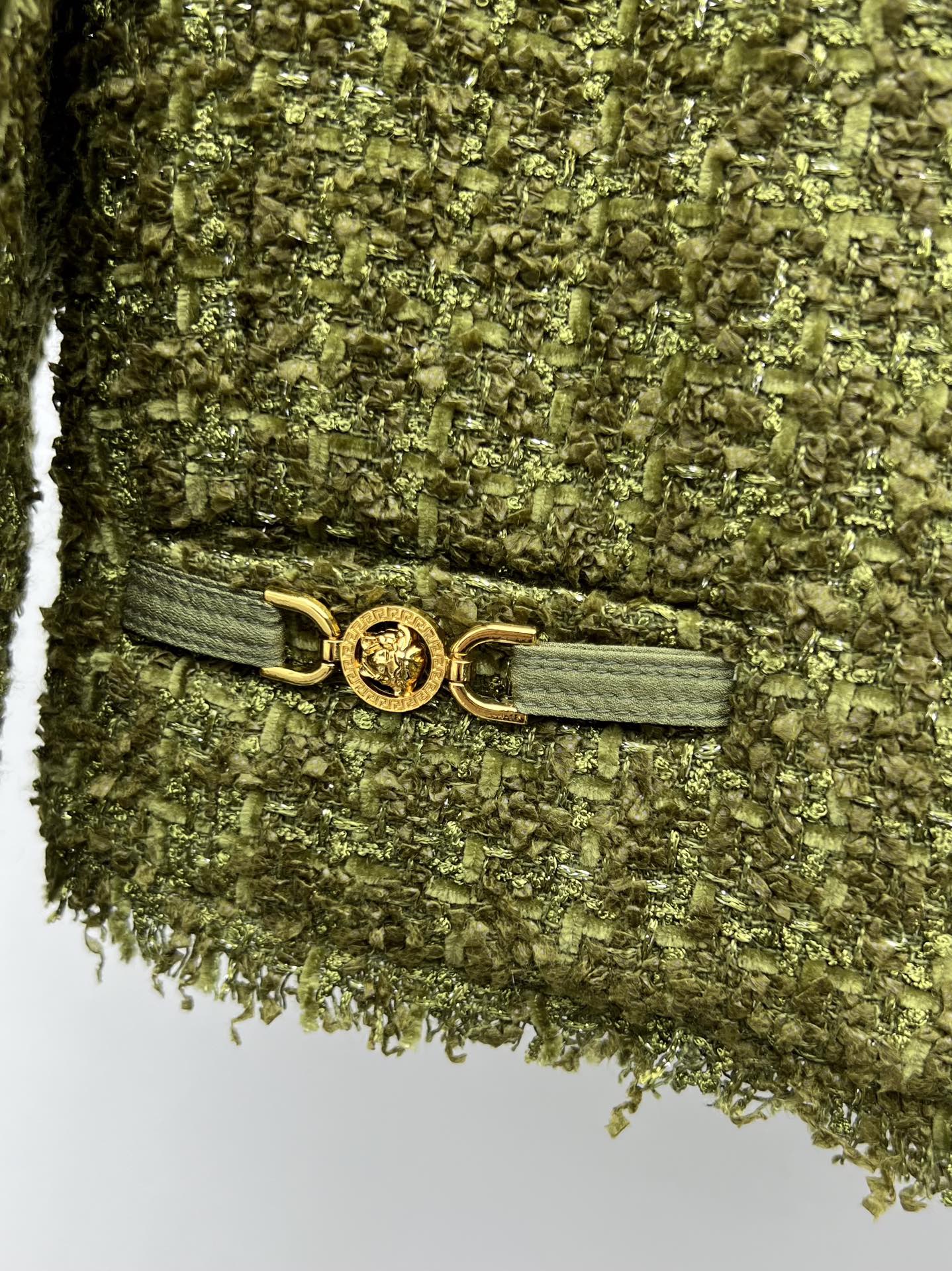 Tweed suit with gold buttons