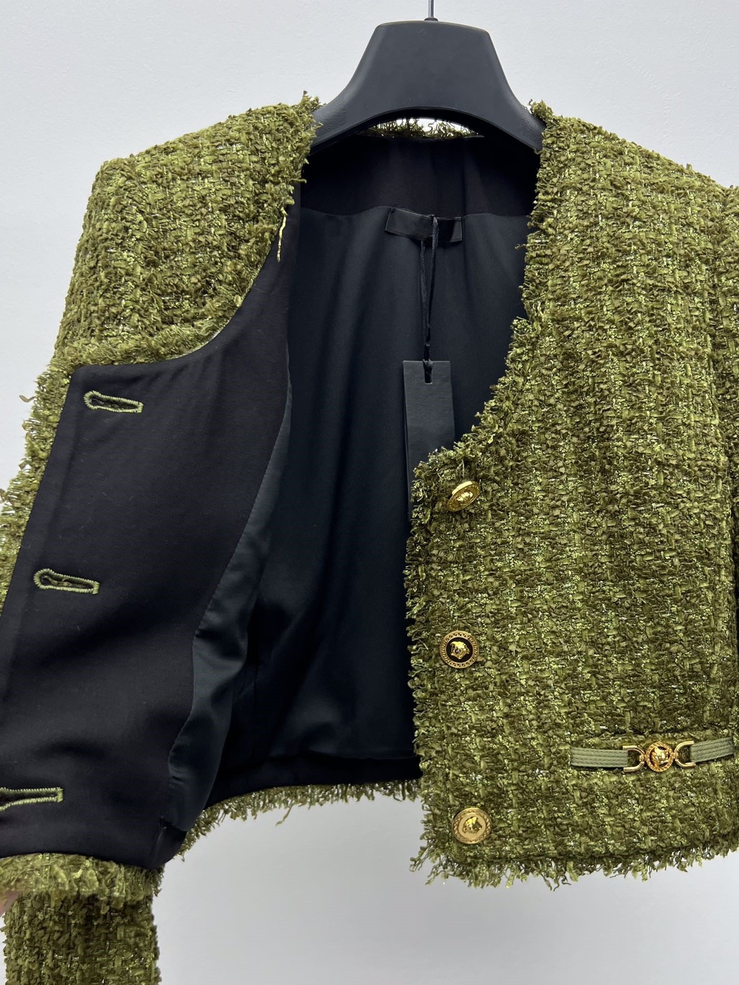 Tweed suit with gold buttons