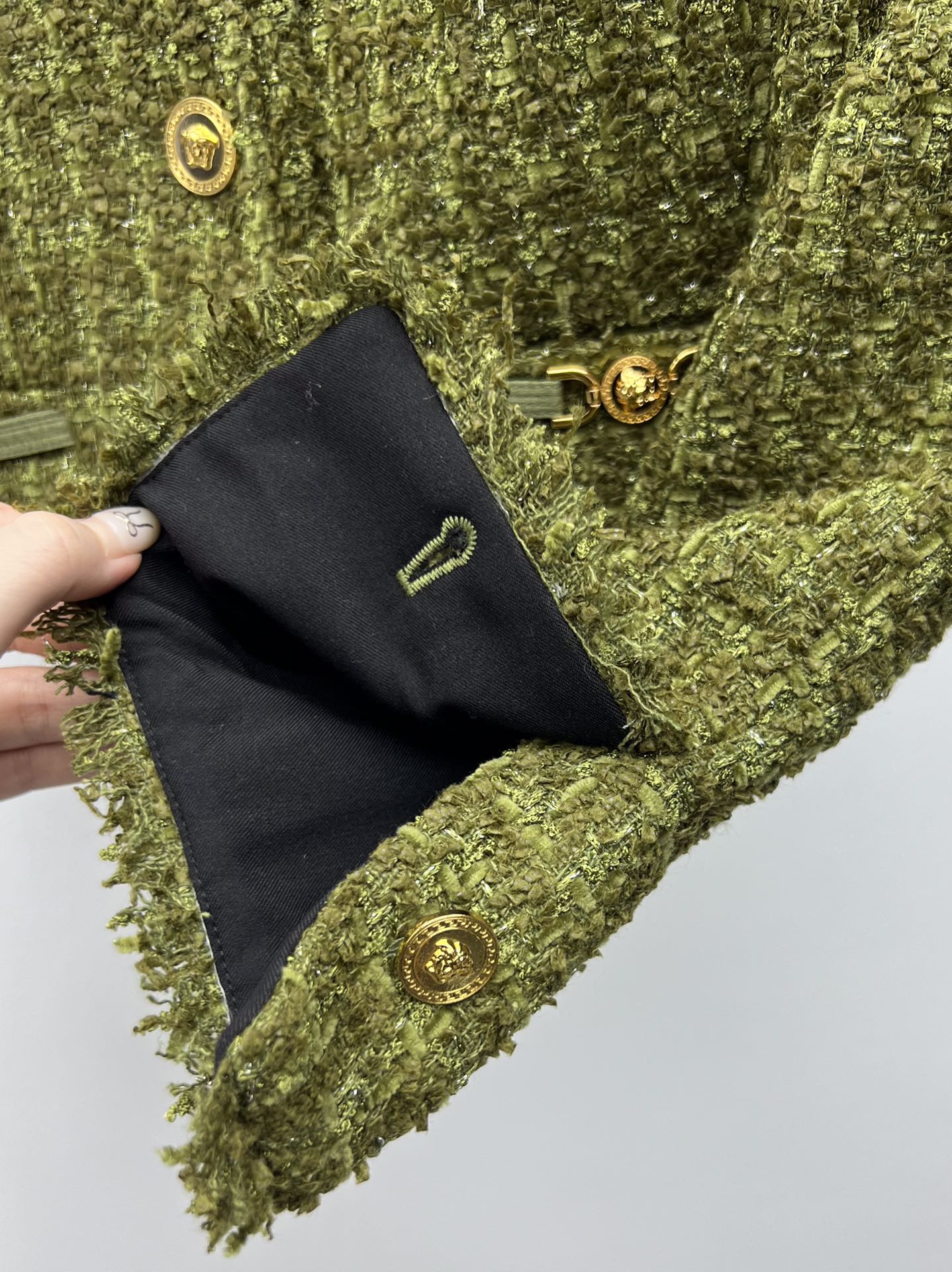 Tweed suit with gold buttons