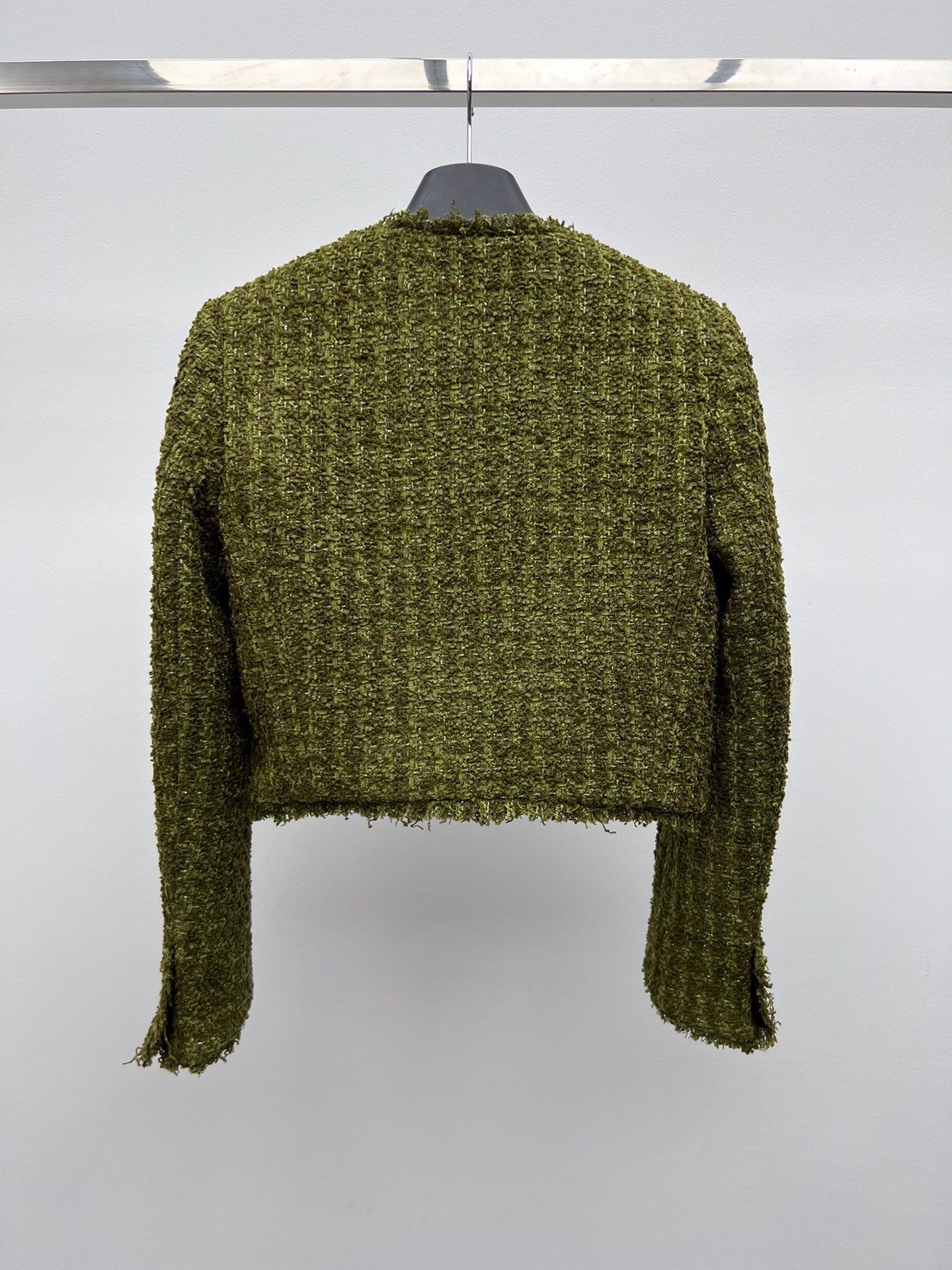 Tweed suit with gold buttons