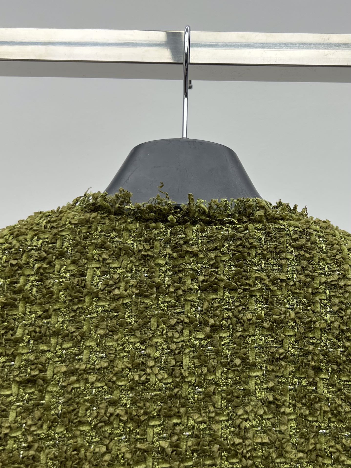 Tweed suit with gold buttons